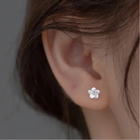 Sterling silver earrings in the shape of a mini flower