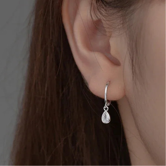 Sterling silver earrings in the shape of a sparkling water drop