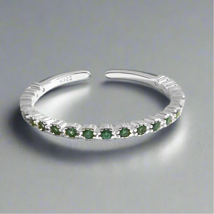 Minimalist sterling silver ring decorated with green zircon crystals