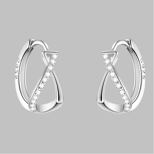 Twisted effect sterling silver earrings with zircon crystals