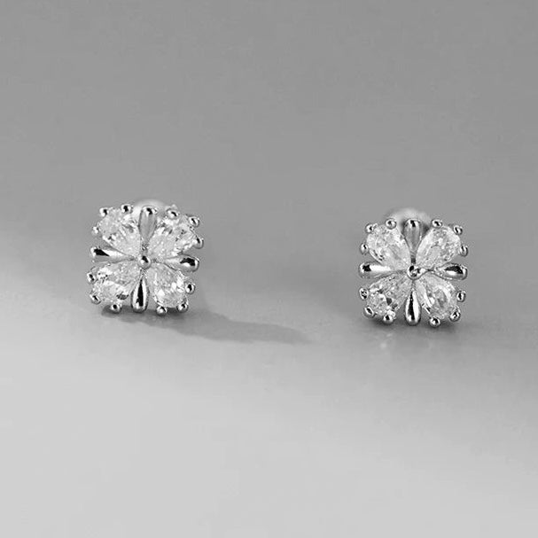 Shiny clover-shaped sterling silver earrings with zircon crystals