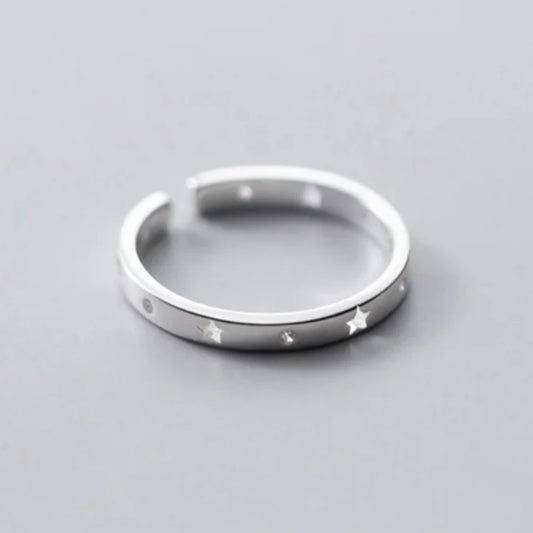 Sterling silver adjustable size ring with a star pattern