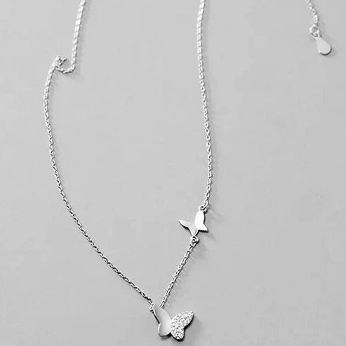 Minimalist sterling silver necklace in the shape of a butterfly