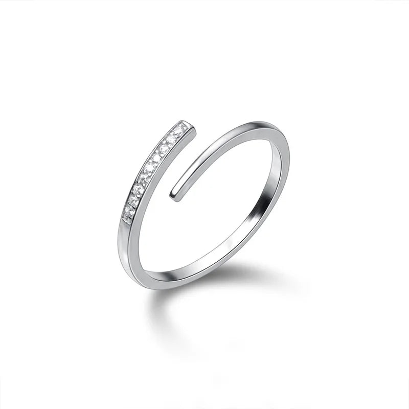 Minimalist sterling silver adjustable size ring with zirconia crystals