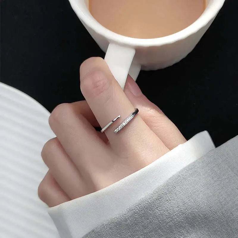 Minimalist sterling silver adjustable size ring with zirconia crystals