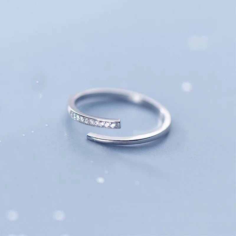 Minimalist sterling silver adjustable size ring with zirconia crystals