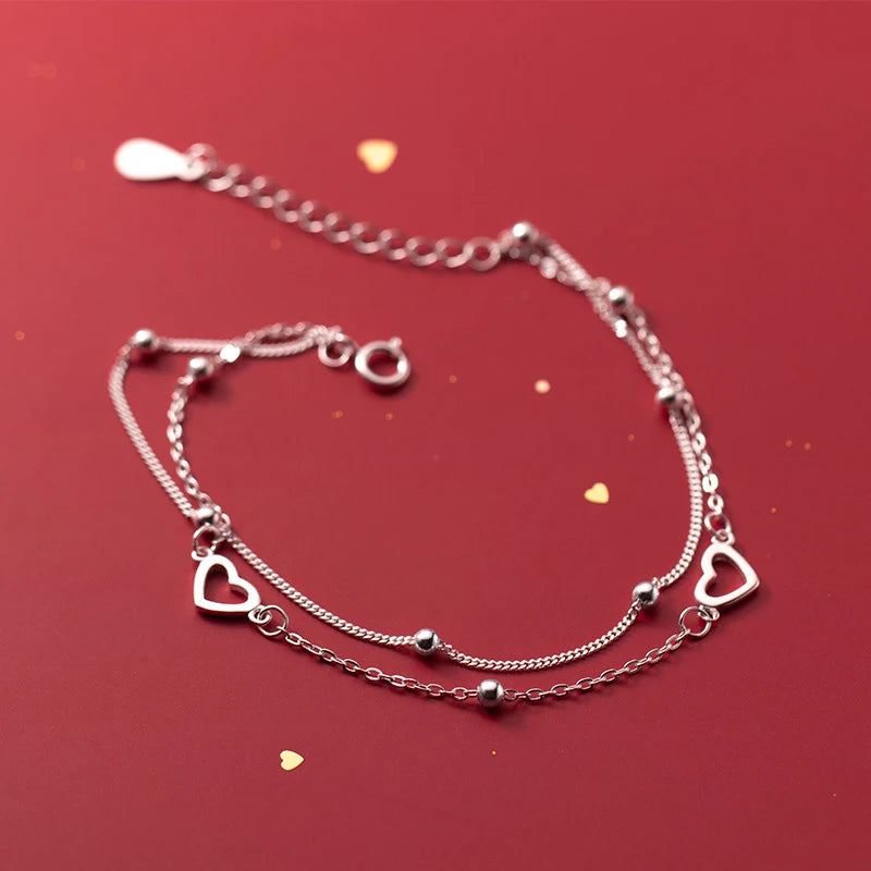 Heart-shaped two-chain sterling silver bracelet