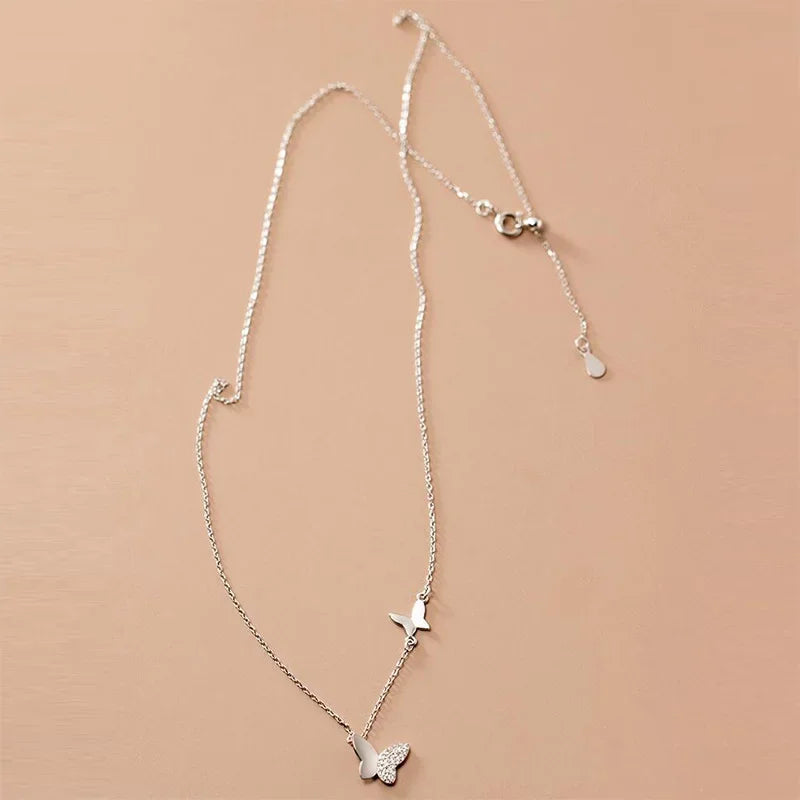 Minimalist sterling silver necklace in the shape of a butterfly