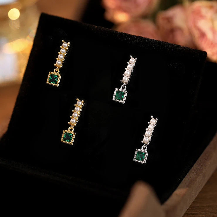 Sterling silver earrings decorated with green zirconia crystals