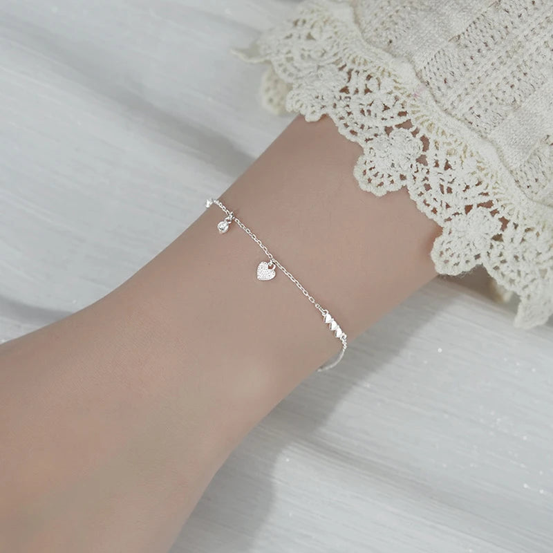 Small heart-shaped ornate sterling silver bracelet