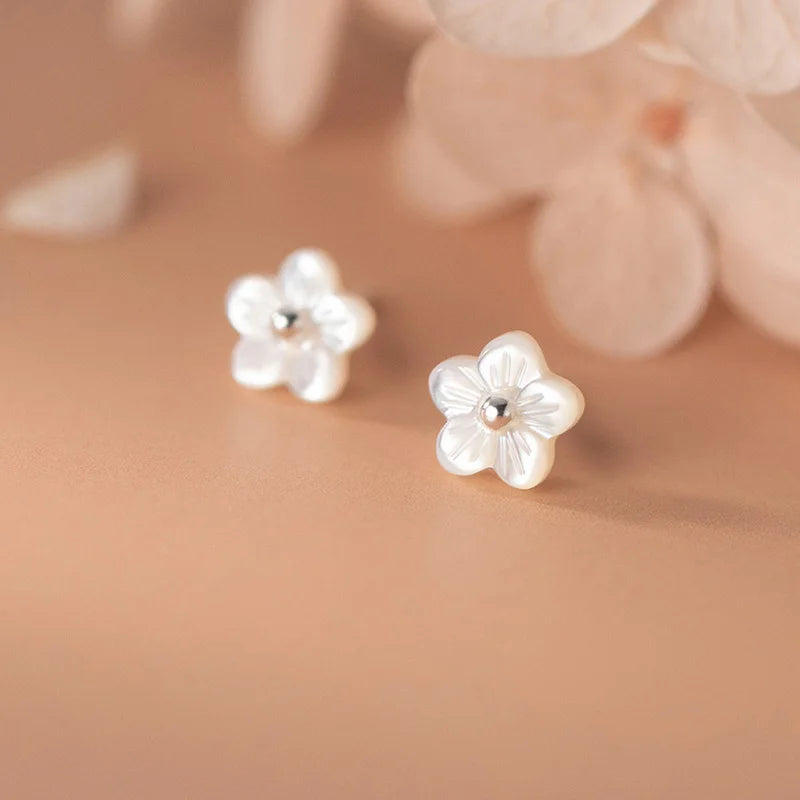 Sterling silver earrings in the shape of a mini flower