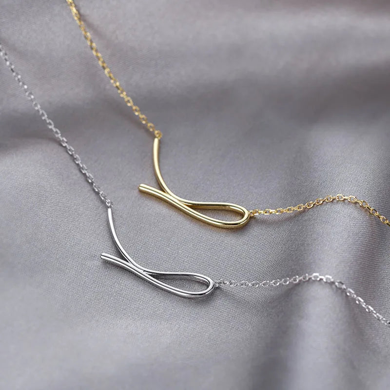 Minimalist wave shaped sterling silver necklace