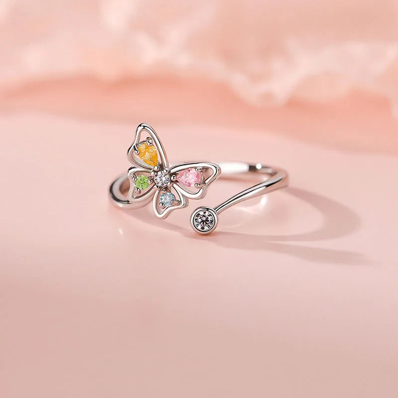 Adjustable size butterfly shaped sterling silver ring with colored zircon crystals