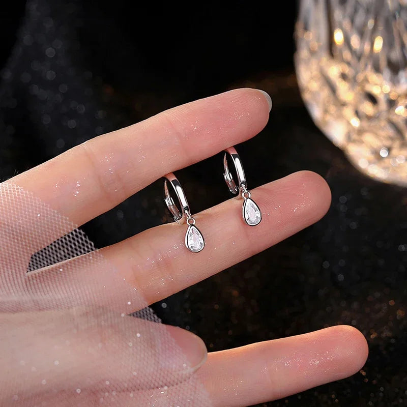 Drop-shaped sterling silver earrings with zircon crystal