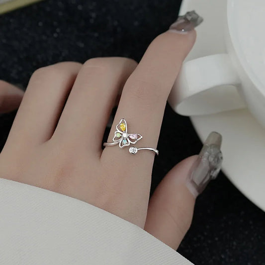 Adjustable size butterfly shaped sterling silver ring with colored zircon crystals