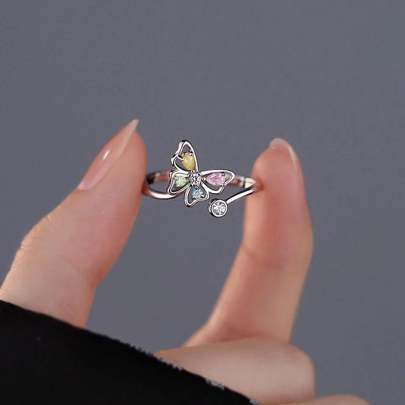 Adjustable size butterfly shaped sterling silver ring with colored zircon crystals