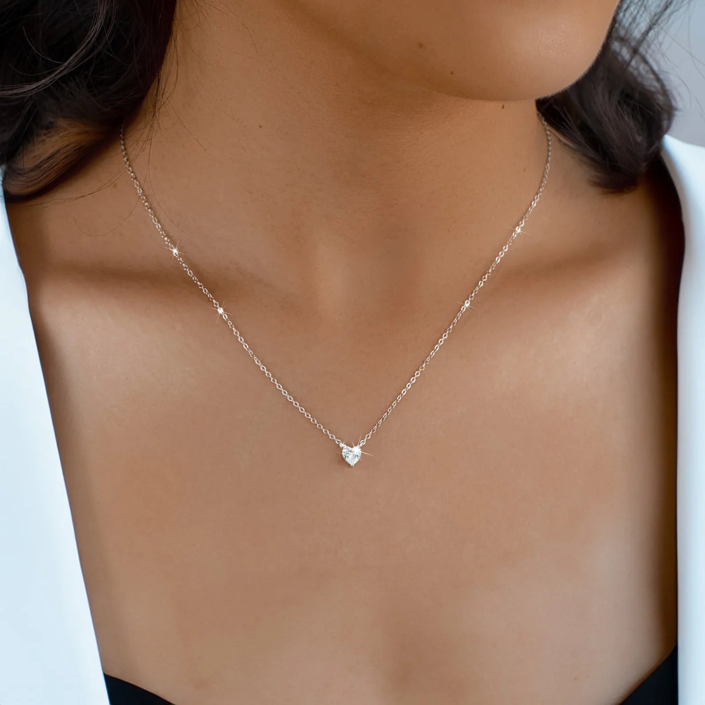 Shiny heart-shaped sterling silver necklace with zircon crystal