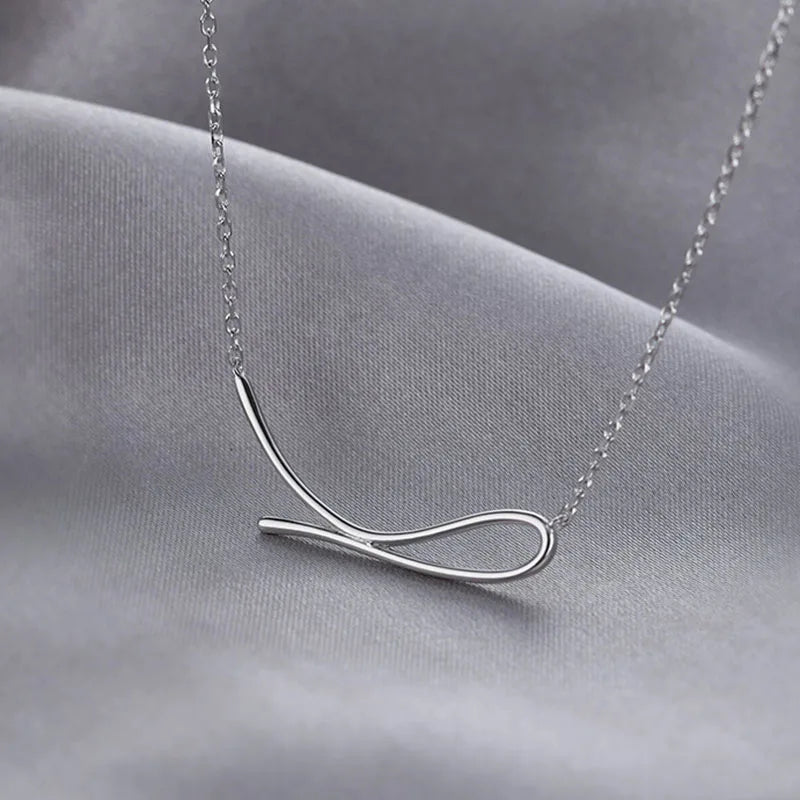 Minimalist wave shaped sterling silver necklace