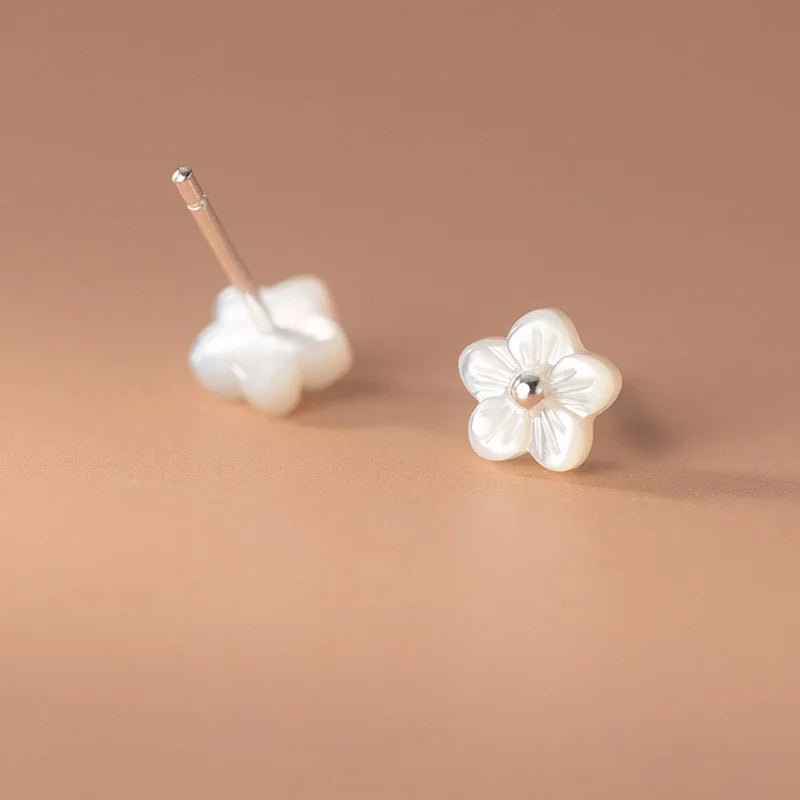 Sterling silver earrings in the shape of a mini flower