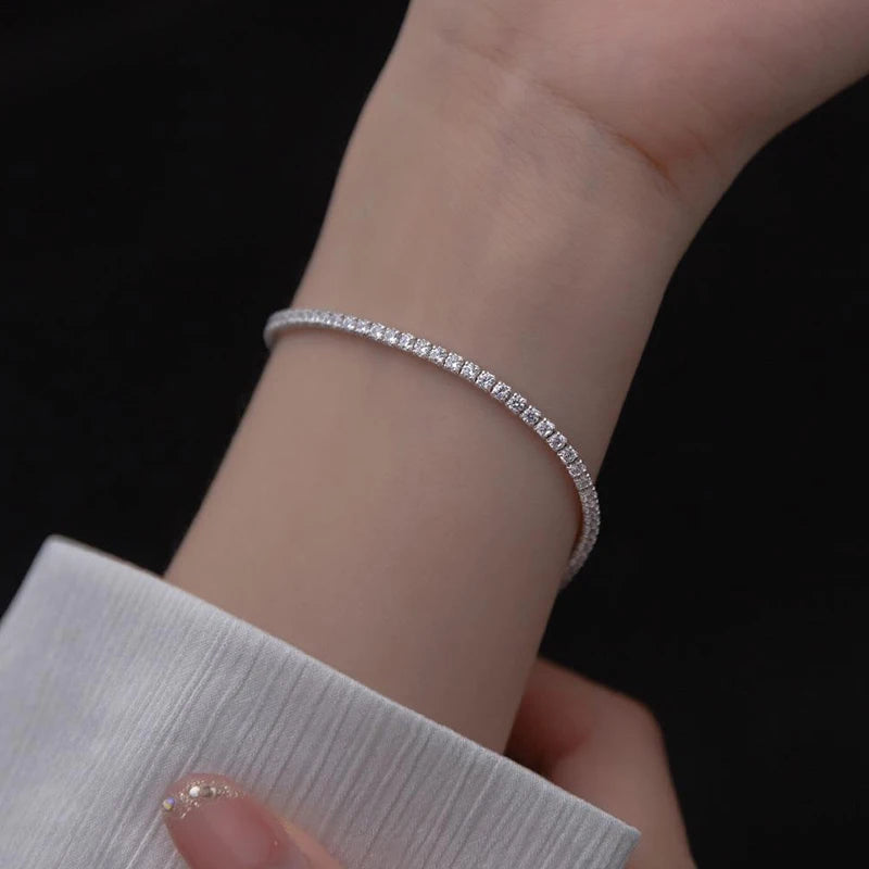 Minimalist sterling silver bracelet decorated with zirconia stones