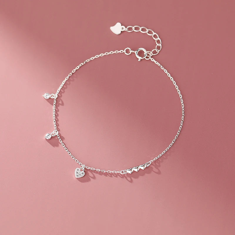 Small heart-shaped ornate sterling silver bracelet