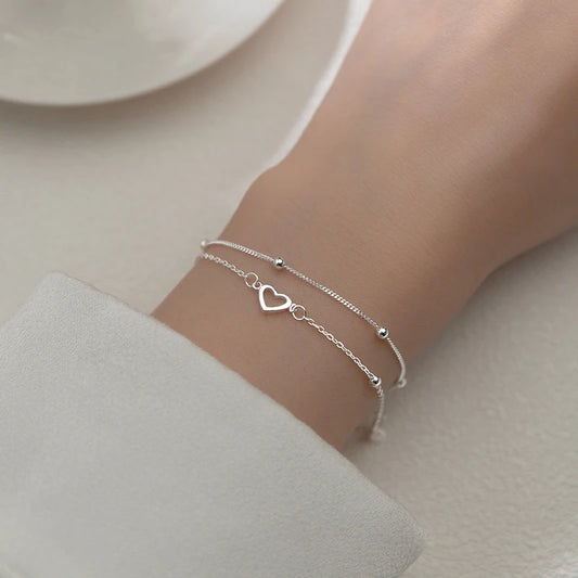 Heart-shaped two-chain sterling silver bracelet